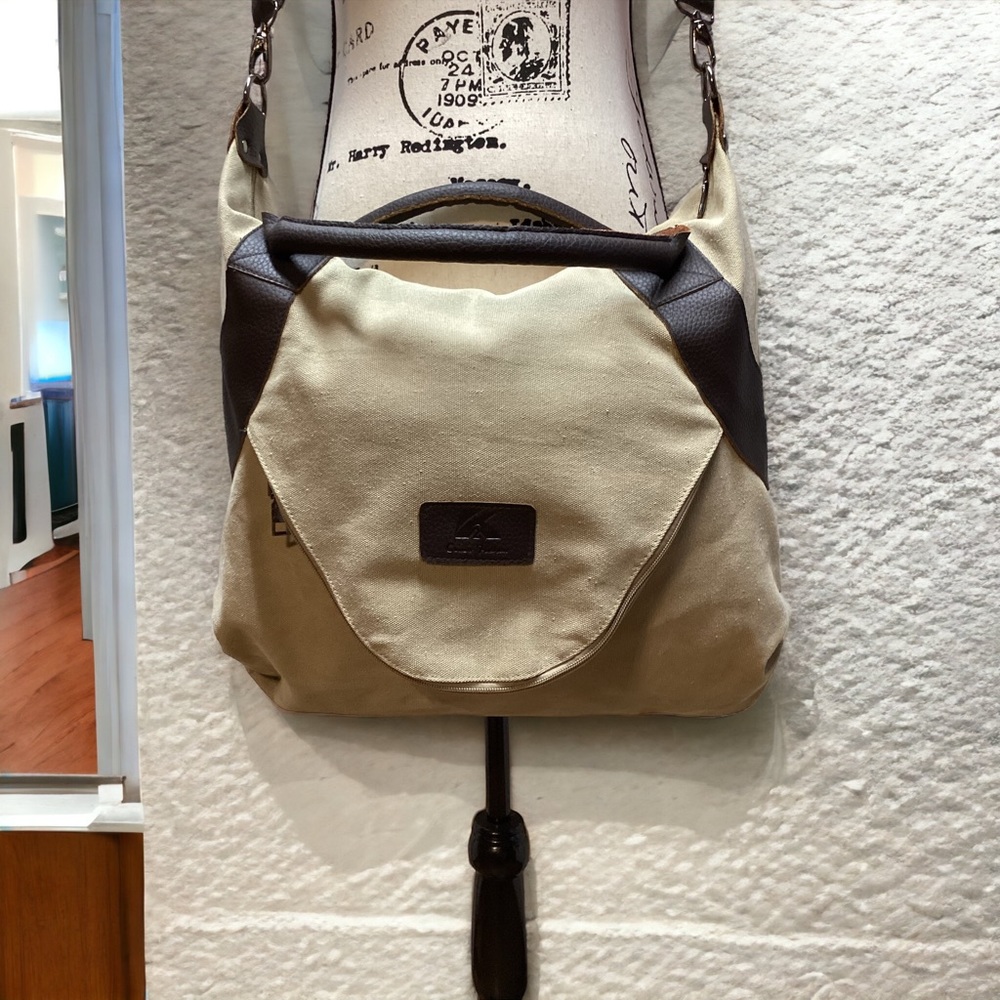Classic Fashion Outback Canvas bag. Tan with pebbled leather handles and trim.